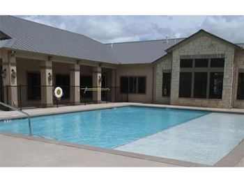 Sparkling swimming pool with lounge deck